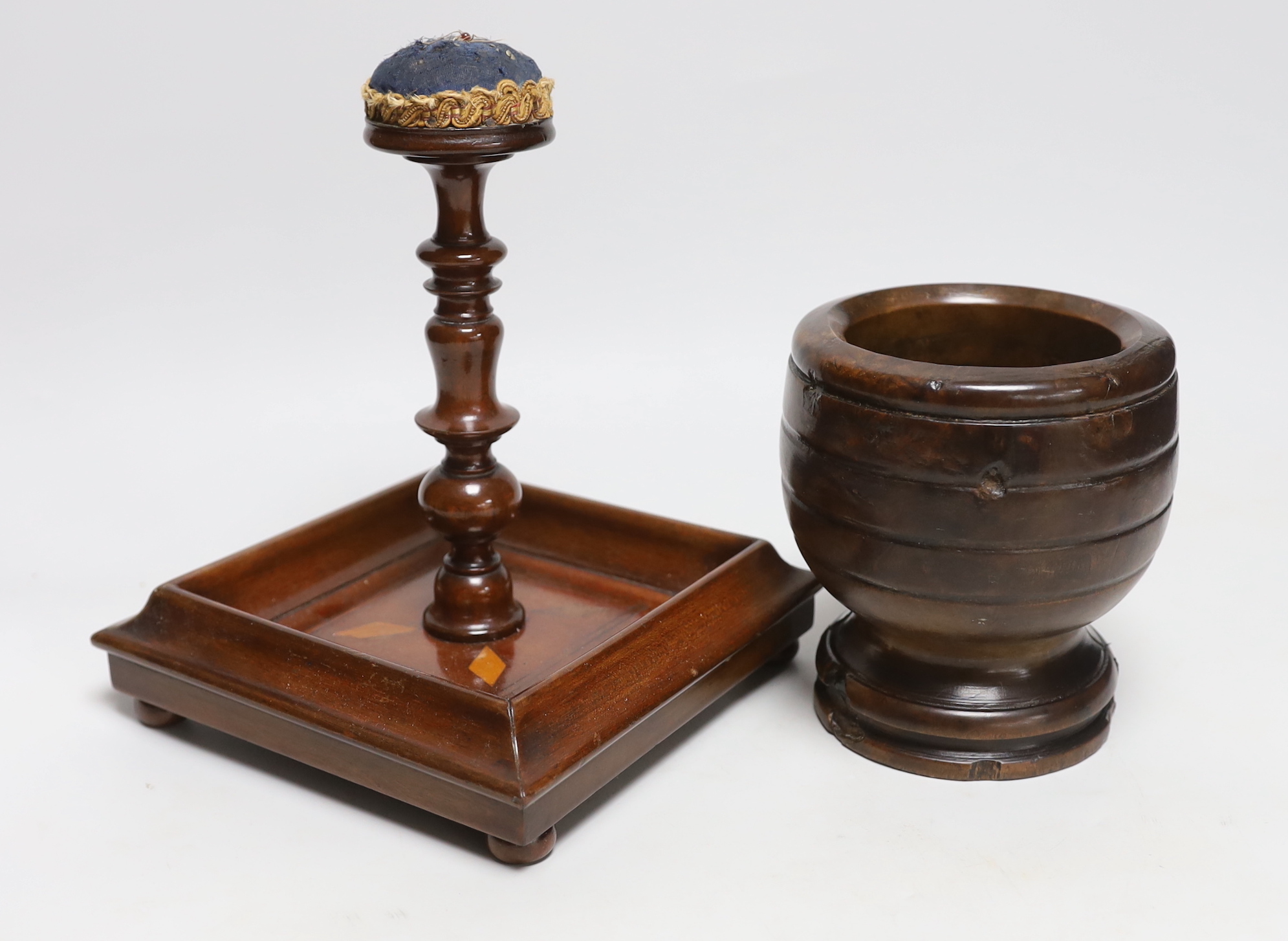 A pincushion stand with tray base, a mahogany vase stand and a hardwood mortar, tallest 22cm high